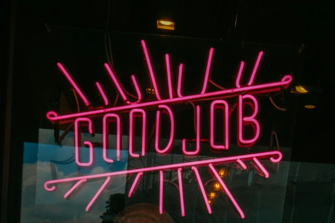 a neon sign that says goodbye on it